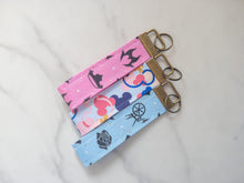 Load image into Gallery viewer, Make It Pink Make It Blue Collection Wristlet Key Fobs
